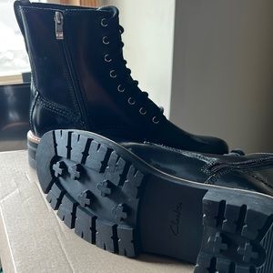 Brand new, never worn black Clark’s lace up boots with zipper. Size 8.5